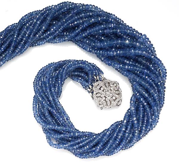 Appraisal: A sapphire and diamond torsade necklace estimated total sapphire weight