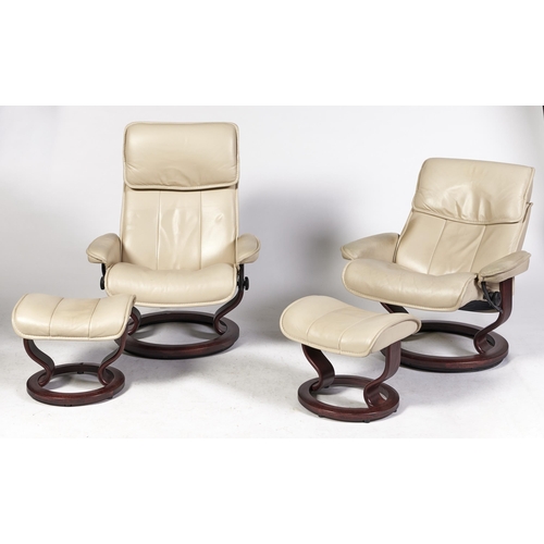 Appraisal: A pair of Stressless faux rosewood cream leather reclining chairs