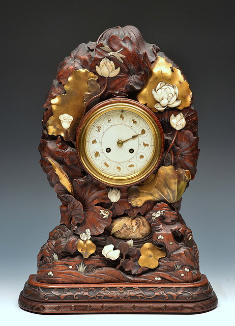 Appraisal: A th Century Japanese hardwood mantel clockthe circular ivory dial