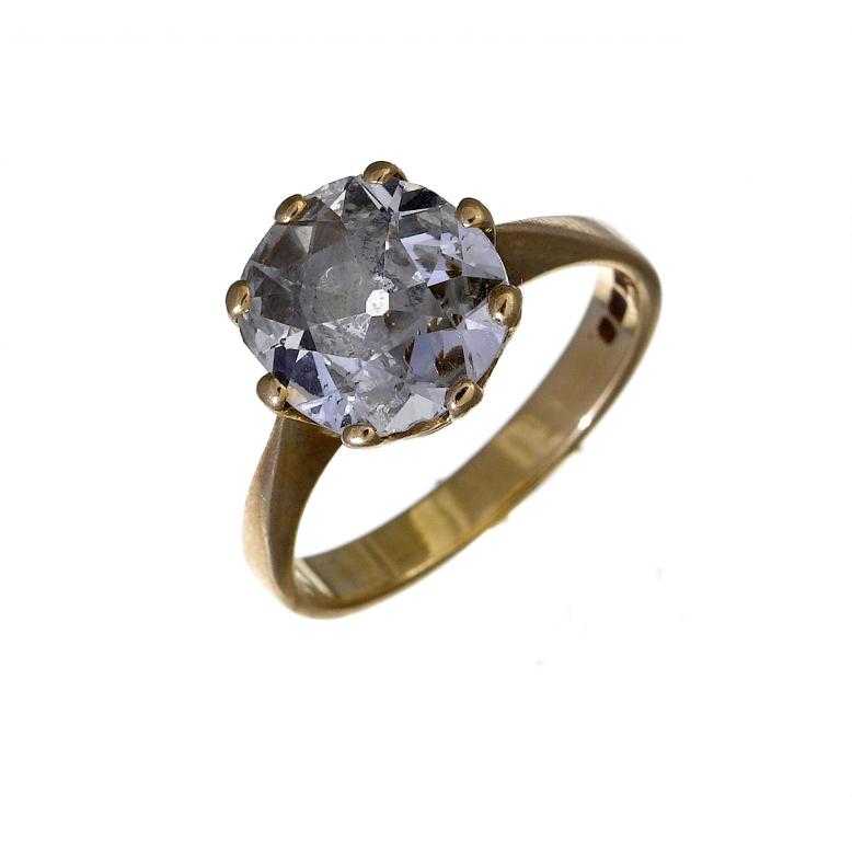 Appraisal: A DIAMOND SOLITAIRE RING with cushion shaped old cut diamond