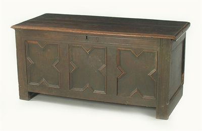 Appraisal: A late th century oak panelled chest the boarded top