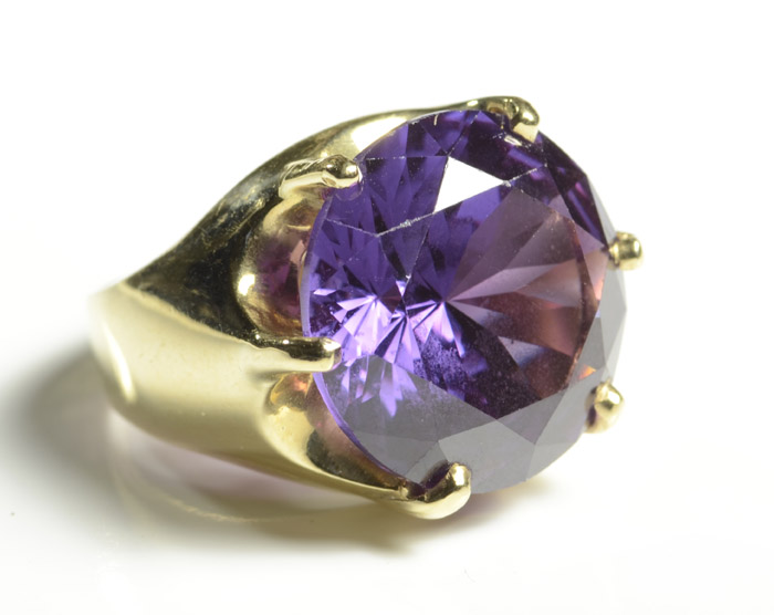 Appraisal: SYNTHETIC ALEXANDRITE AND FOURTEEN KARAT GOLD RING with six yellow