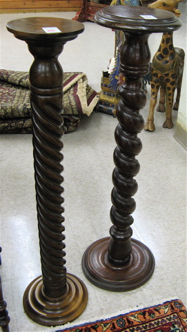 Appraisal: THREE TURNED HARDWOOD PEDESTAL PLANT STANDS two with spiral-turned columns