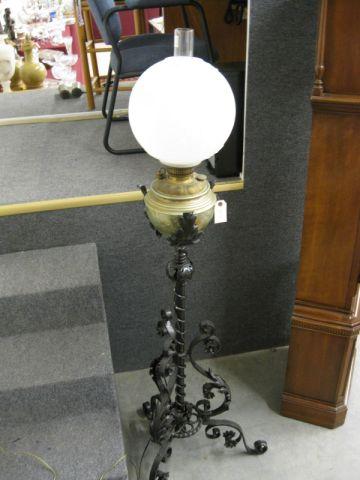 Appraisal: Victorian Cast Iron Floor Lamp ornate metalwork frosted globe on