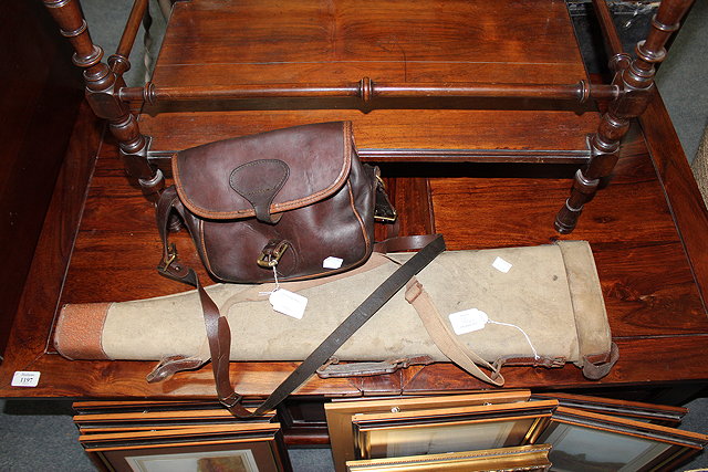 Appraisal: A SHOULDER OF MUTTON CANVAS AND LEATHER REINFORCED GUN CASE