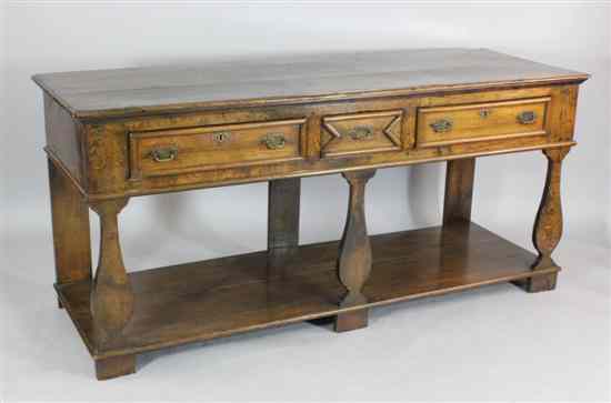 Appraisal: An th century design oak dresser with three drawers above