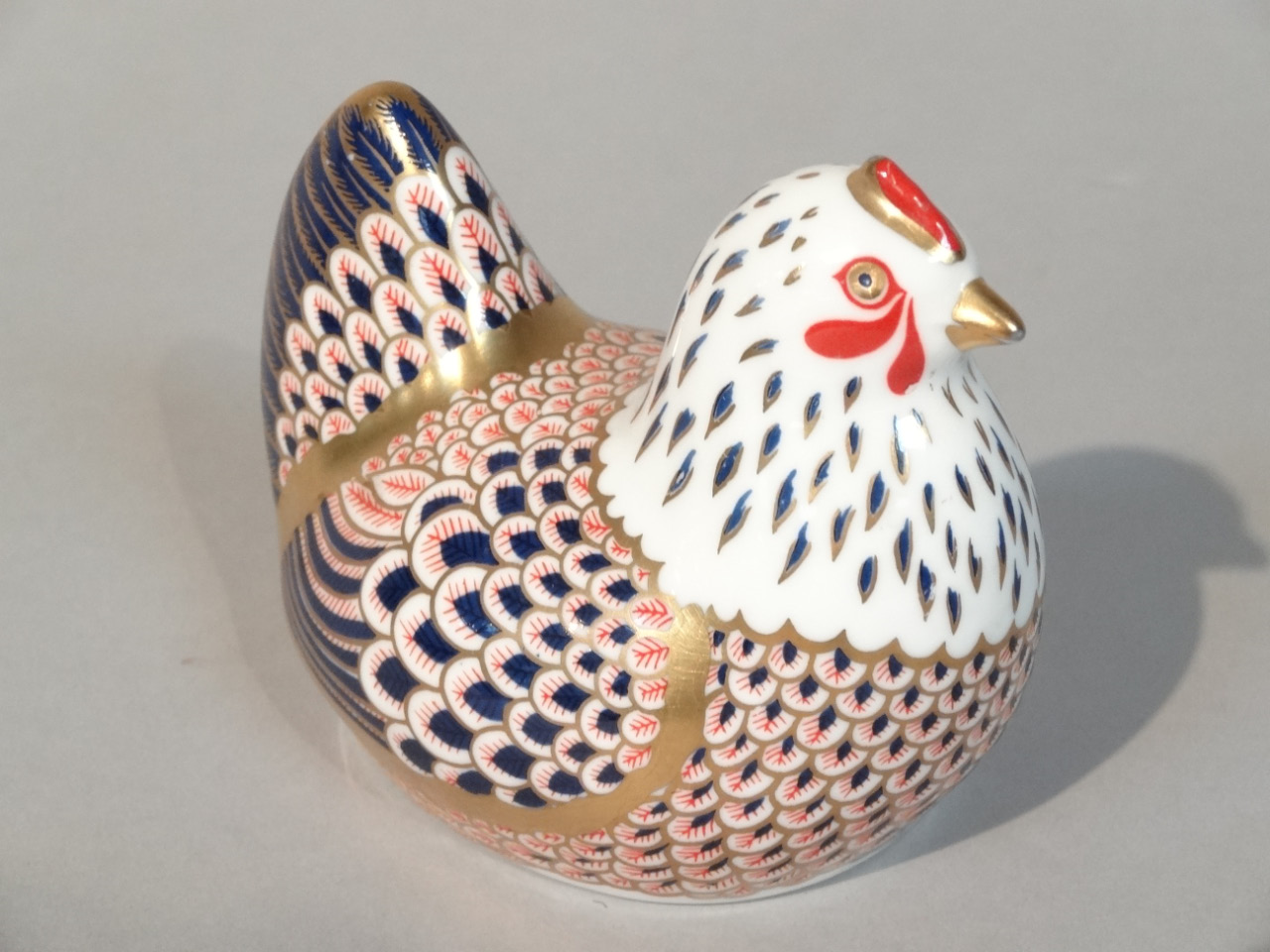 Appraisal: A Royal Crown Derby hen paperweight Imari pattern gold stopper