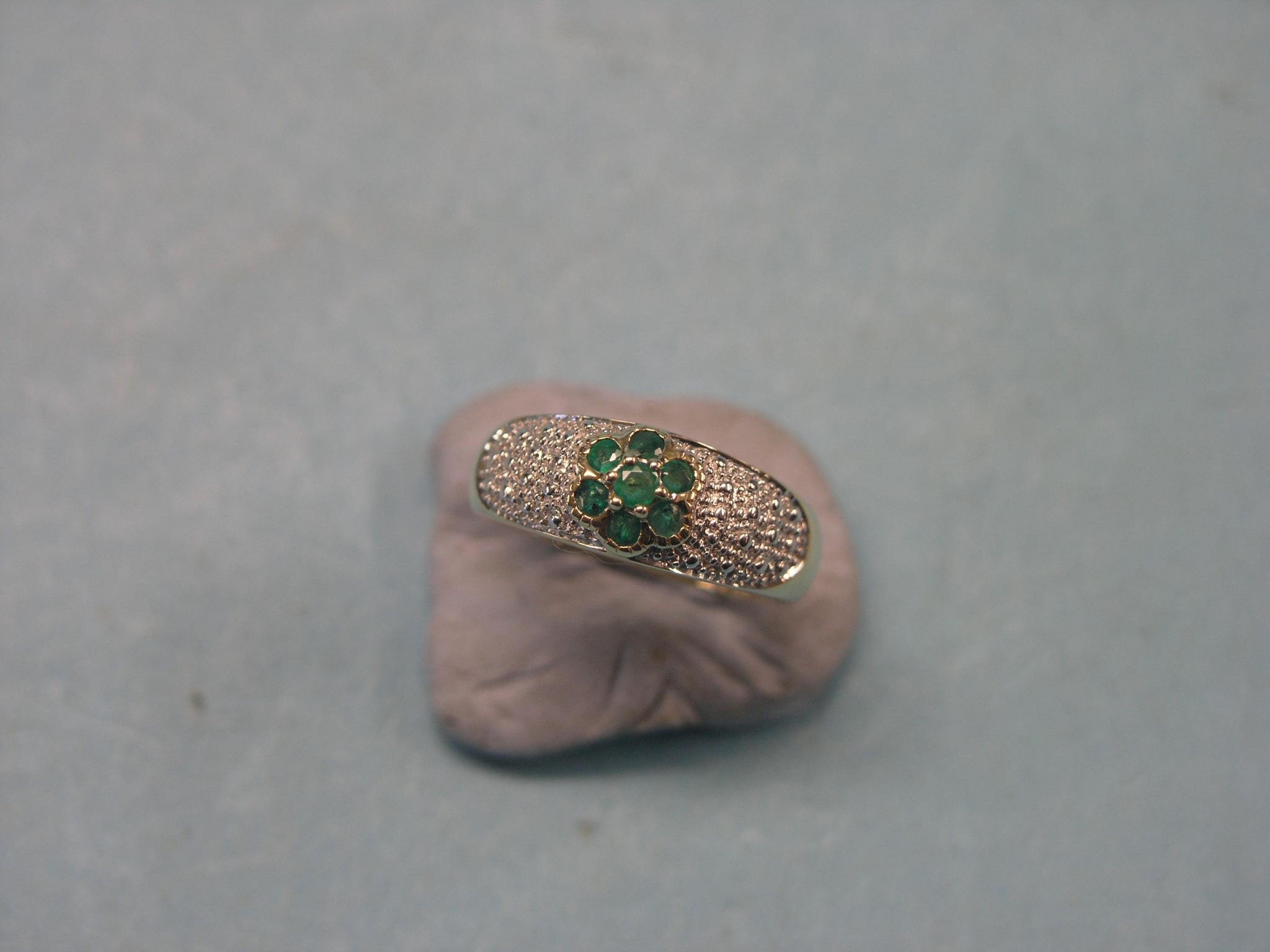 Appraisal: A modern ct gold ring pave-set with an emerald rosette