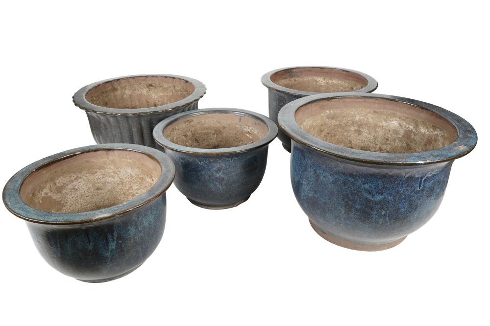 Appraisal: FIVE ASSORTED BLUE GLAZED CERAMIC PLANTERSunmarked each drilled the first