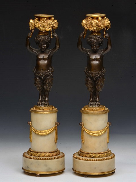 Appraisal: A PAIR OF BRONZE ORMOLU AND WHITE MARBLE CANDLESTICKS with