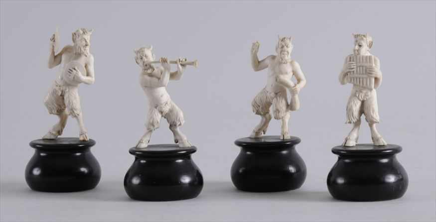 Appraisal: SET OF FOUR CONTINENTAL CARVED IVORY MUSICAL SATYRS Variously carved