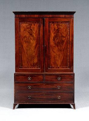 Appraisal: Georgian figured mahogany linen press highly figured mahogany veneers upper