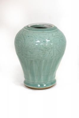 Appraisal: A th Century Chinese celadon vase with incised floral decoration