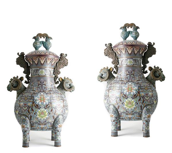 Appraisal: A pair of cloisonne enameled metal footed urns with ram's