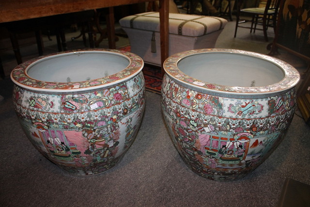 Appraisal: A PAIR OF LARGE REPRODUCTION CHINESE FISH TANKS decorated in