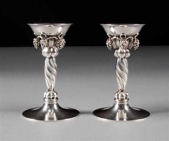 Appraisal: Pair of Danish sterling silver candlesticks in the ''Grape'' pattern