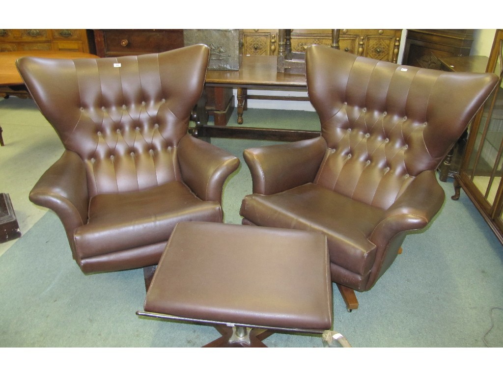 Appraisal: Pair of retro wing armchairs with stool