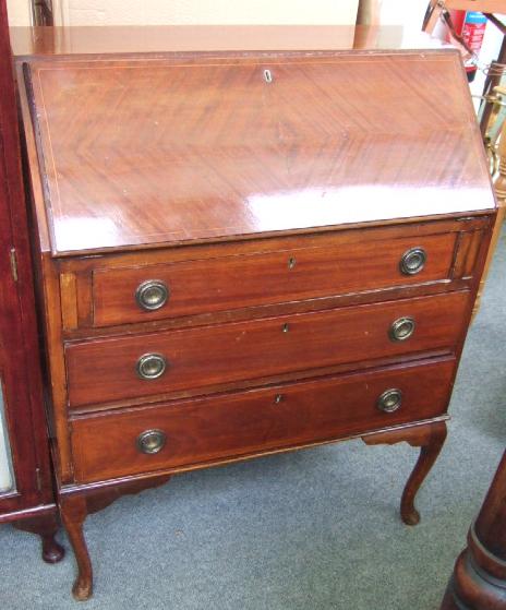 Appraisal: An Edwardian inlaid mahogany bureau the fall enclosing a fitted