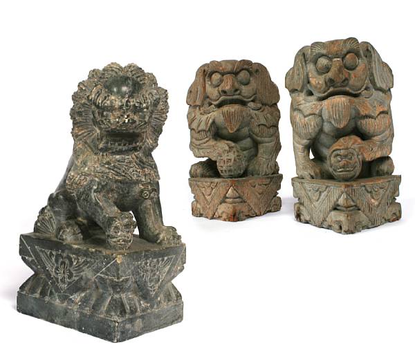 Appraisal: A pair of paint decorated wood carved lions and a