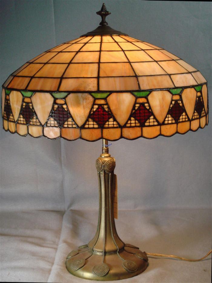 Appraisal: Leaded glass table lamp with unsigned shade signed Handel base