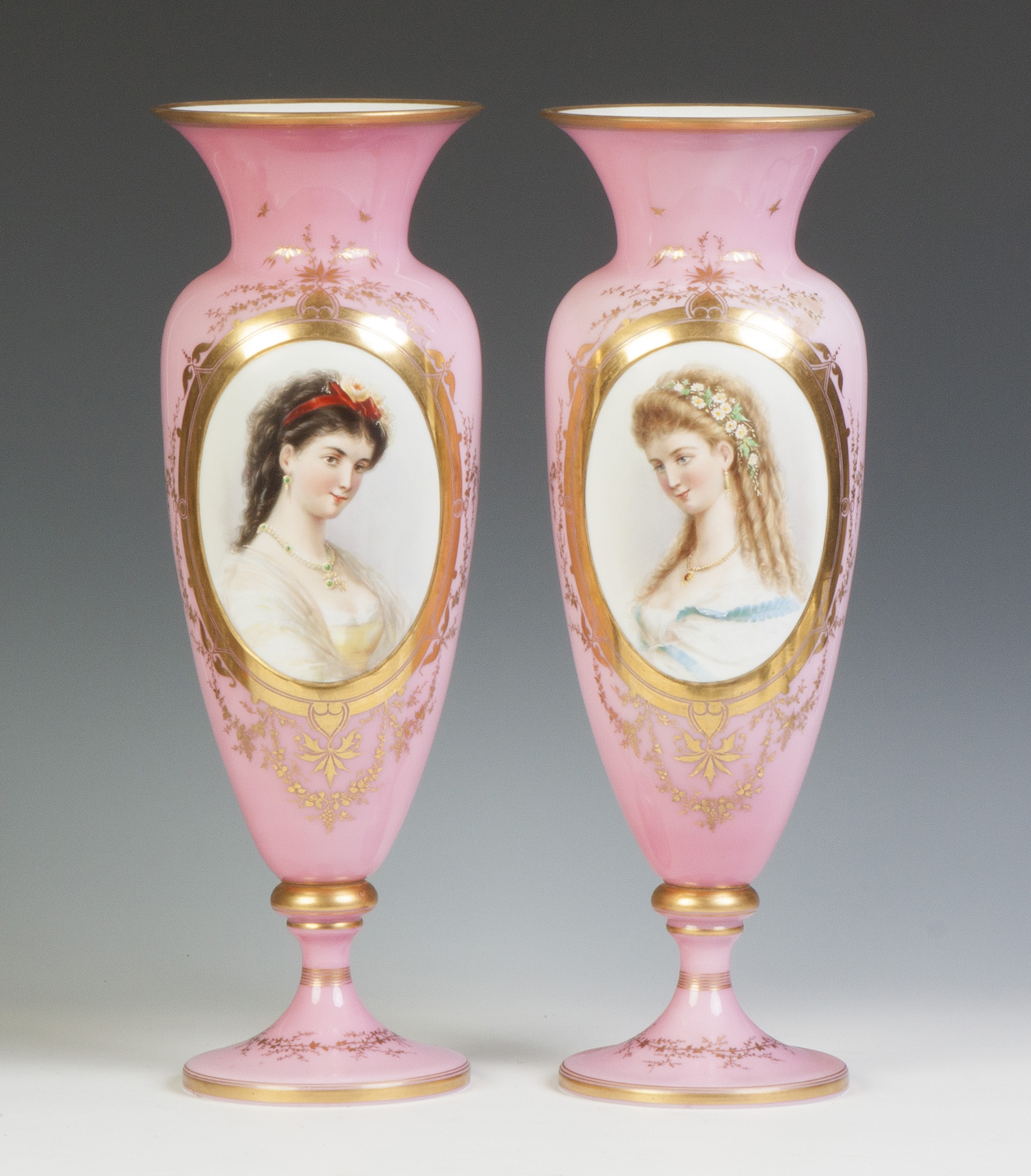 Appraisal: Pair of Cased Glass Portrait Vases th cent Hand painted