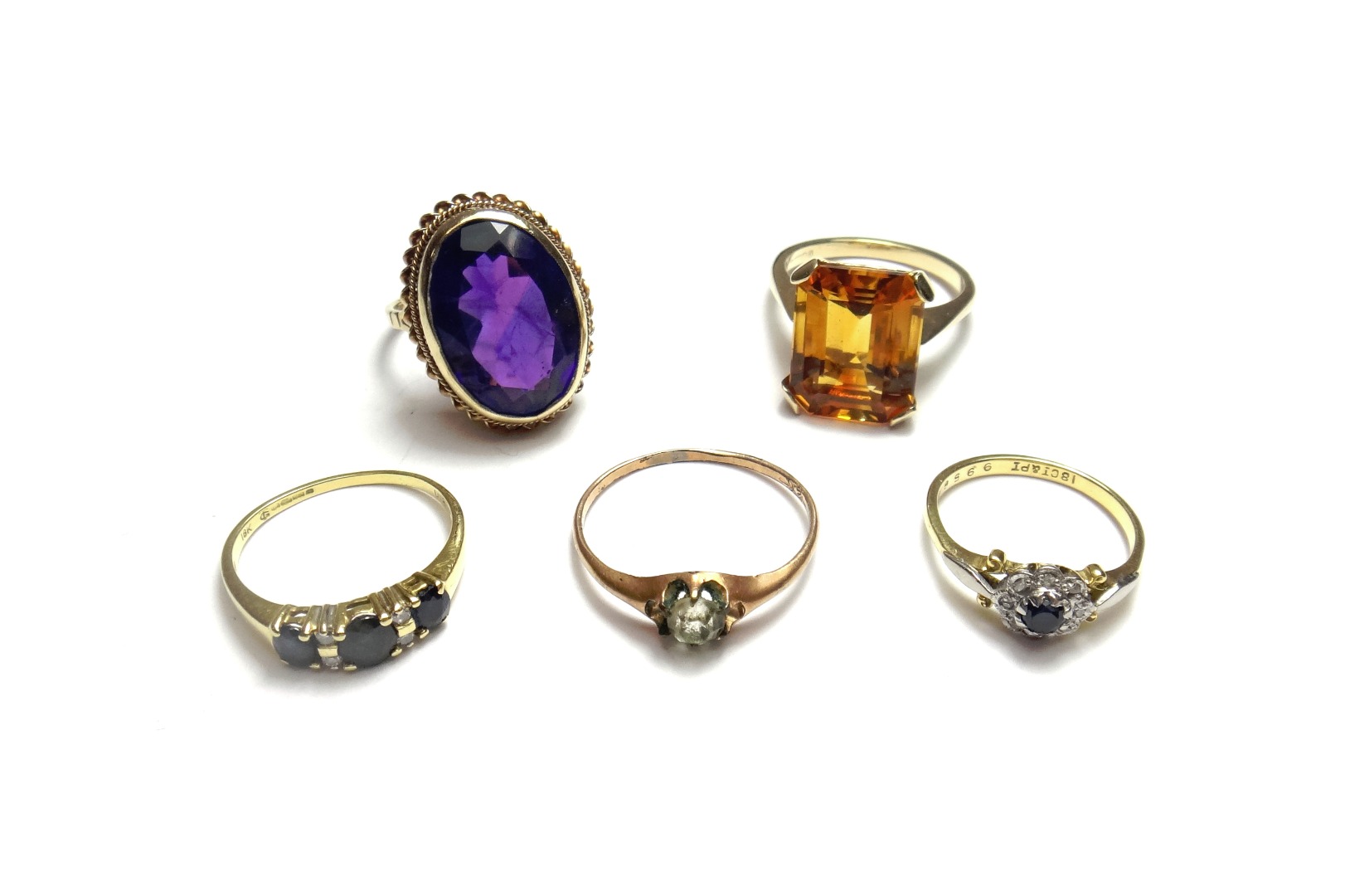 Appraisal: A ct gold ring collet set with an oval cut