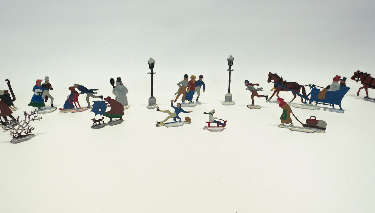 Appraisal: COLLECTION OF HEINRICHSEN FLAT METAL FIGURES all are winter scenes