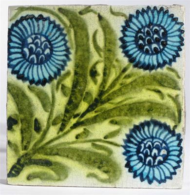 Appraisal: A William De Morgan tile painted with three stylised sunflowers