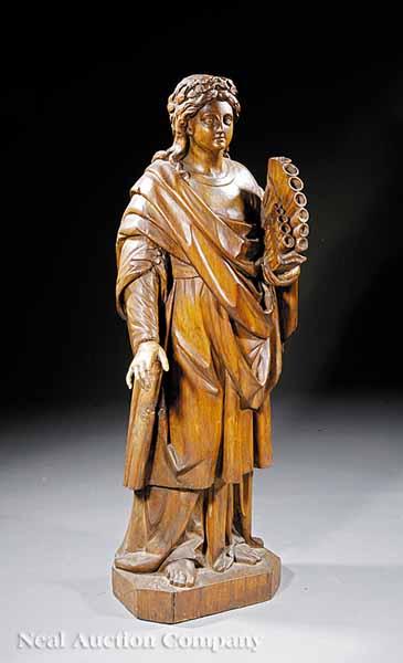 Appraisal: A Continental Carved Wood Figure of a Shepherd Holding Reed