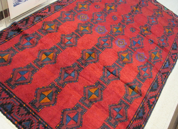 Appraisal: PERSIAN BAKHTIARI TRIBAL CARPET hand knotted in a repeating geometric