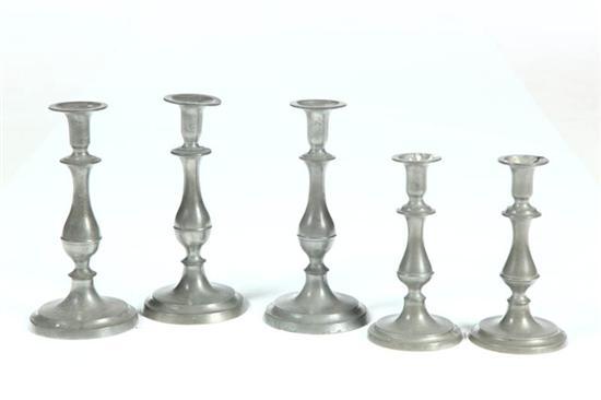 Appraisal: FIVE PEWTER CANDLESTICKS American mid th century Similar in form