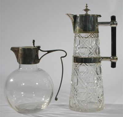 Appraisal: An Aesthetic Movement electroplated metal and cut glass claret jug