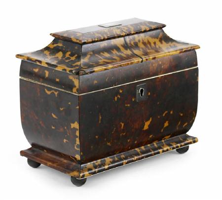 Appraisal: A Regency tortoiseshell tea caddy of sarcophagus form with ivory