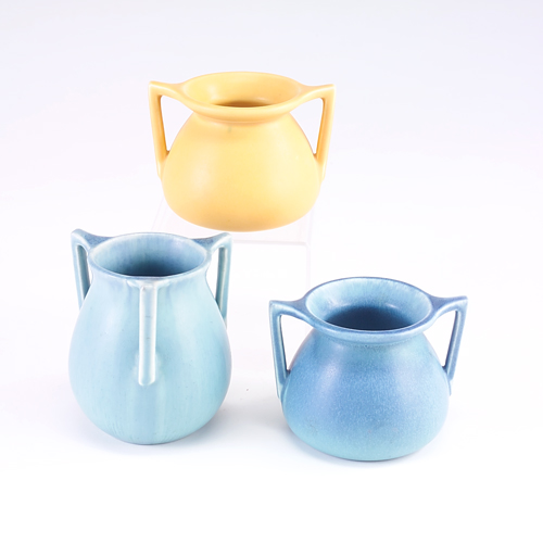 Appraisal: ROOKWOOD Three Production vessels with angular handles one blue one