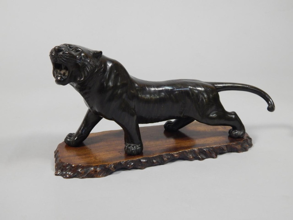 Appraisal: A Meiji period bronze figure of a lion signed to