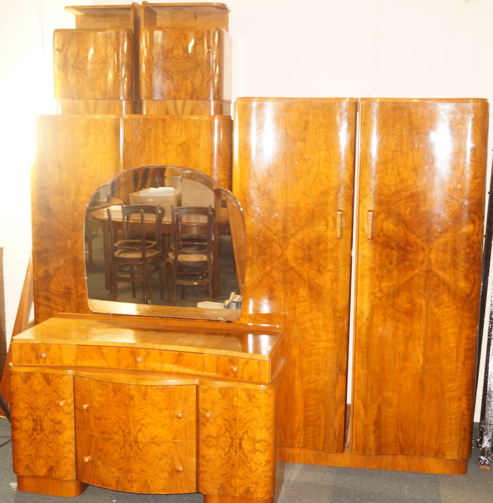 Appraisal: An Art Deco figured walnut bedroom suite comprising two wardrobes