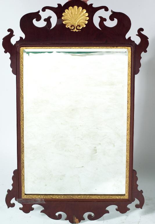 Appraisal: GEORGE III PARCEL-GILT MAHOGANY FRETWORK MIRROR the later bevelled plate