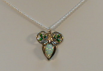 Appraisal: A white metal and faux opal pendant