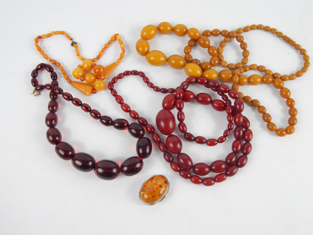 Appraisal: Three necklaces comprising of a butterscotch amber colour graduated bead