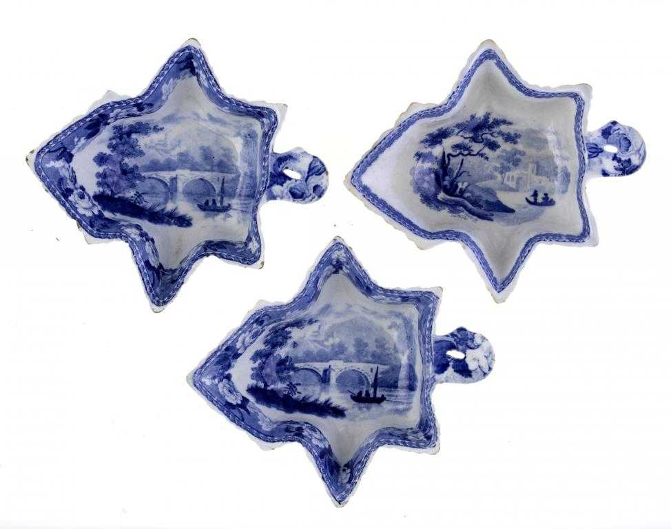 Appraisal: THREE WEDGWOOD BLUE PRINTED PEARL WARE PICKLE DISHES of vine