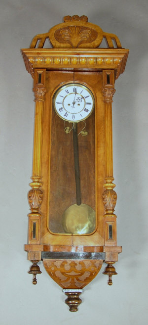 Appraisal: A late th century walnut cased Vienna regulator wall clock