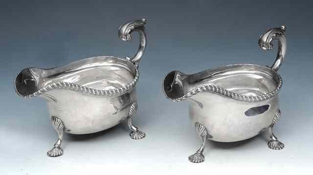 Appraisal: A PAIR OF GEORGE V SILVER SAUCE BOATS with gadrooned