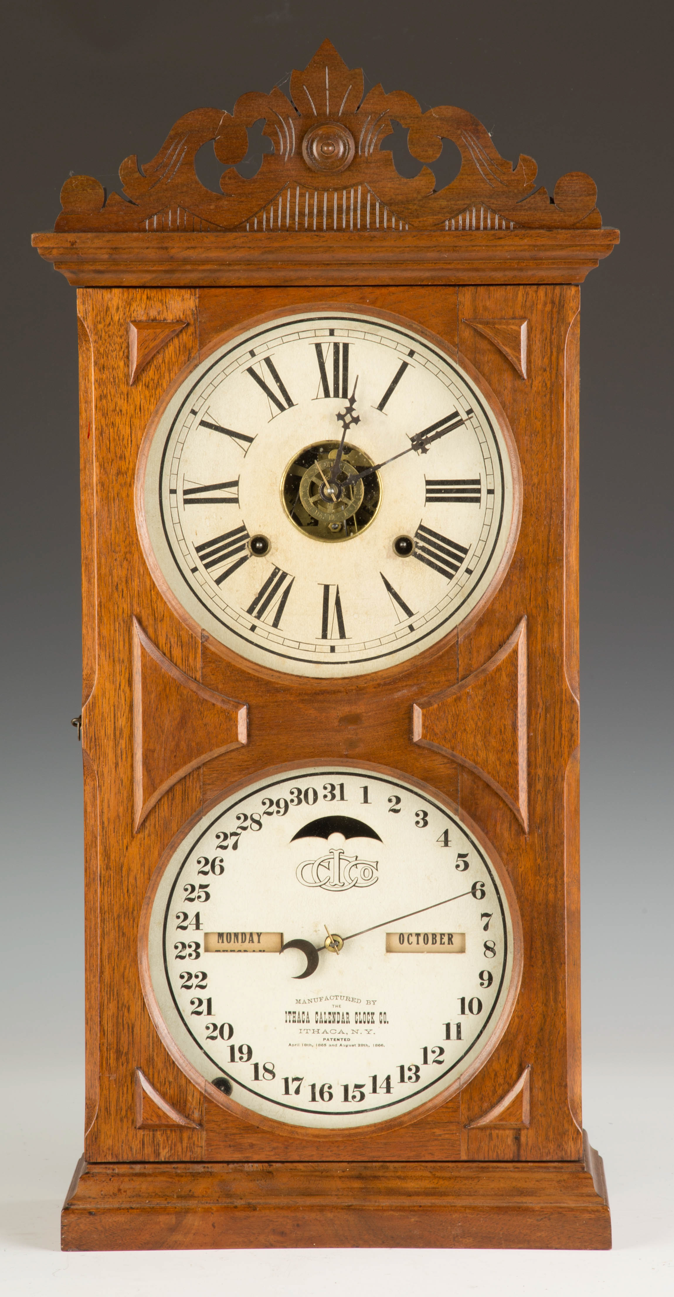 Appraisal: Ithaca Double Dial Calendar Shelf Clock Case refinished crest is