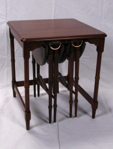 Appraisal: Set of cherry drop-leaf nesting tables solid top main table