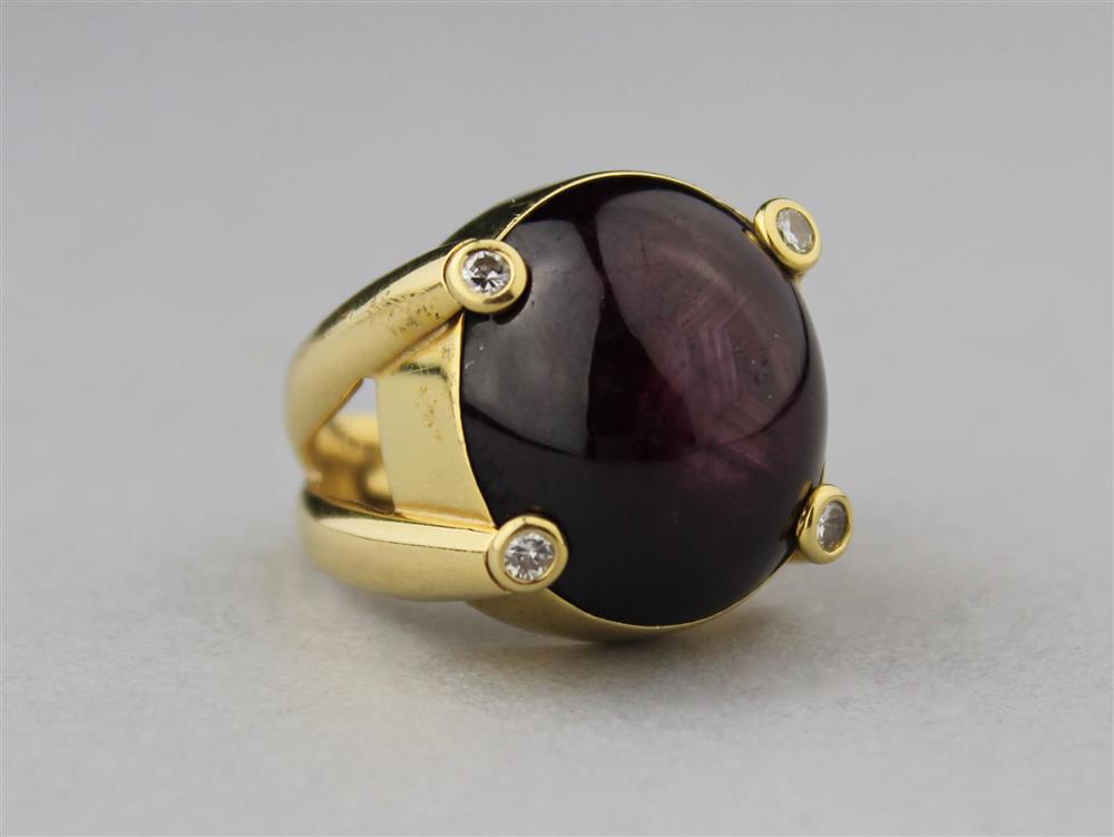 Appraisal: STAR SAPPHIRE CABOCHON AND DIAMOND RING IN K YELLOW GOLD