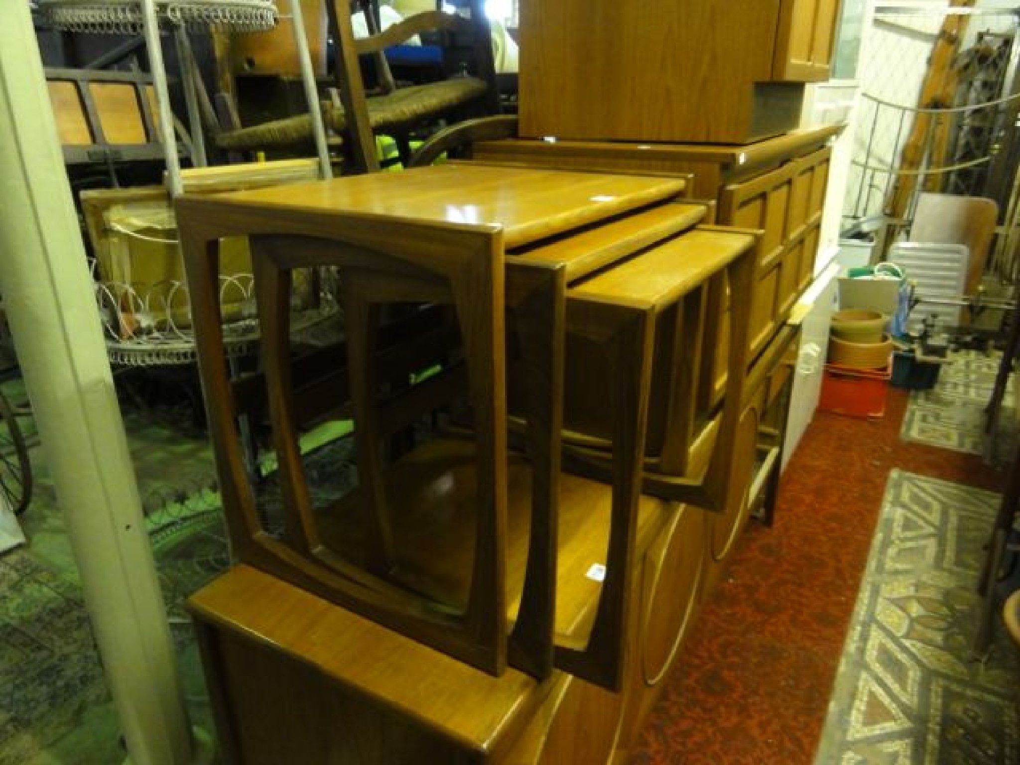 Appraisal: A nest of three mid th century teak graduated occasional