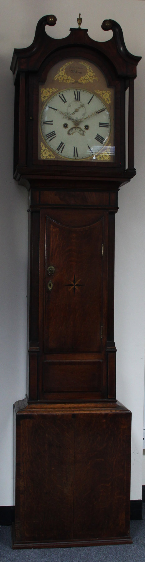 Appraisal: An oak cased eight-day longcase clock the painted arch dial