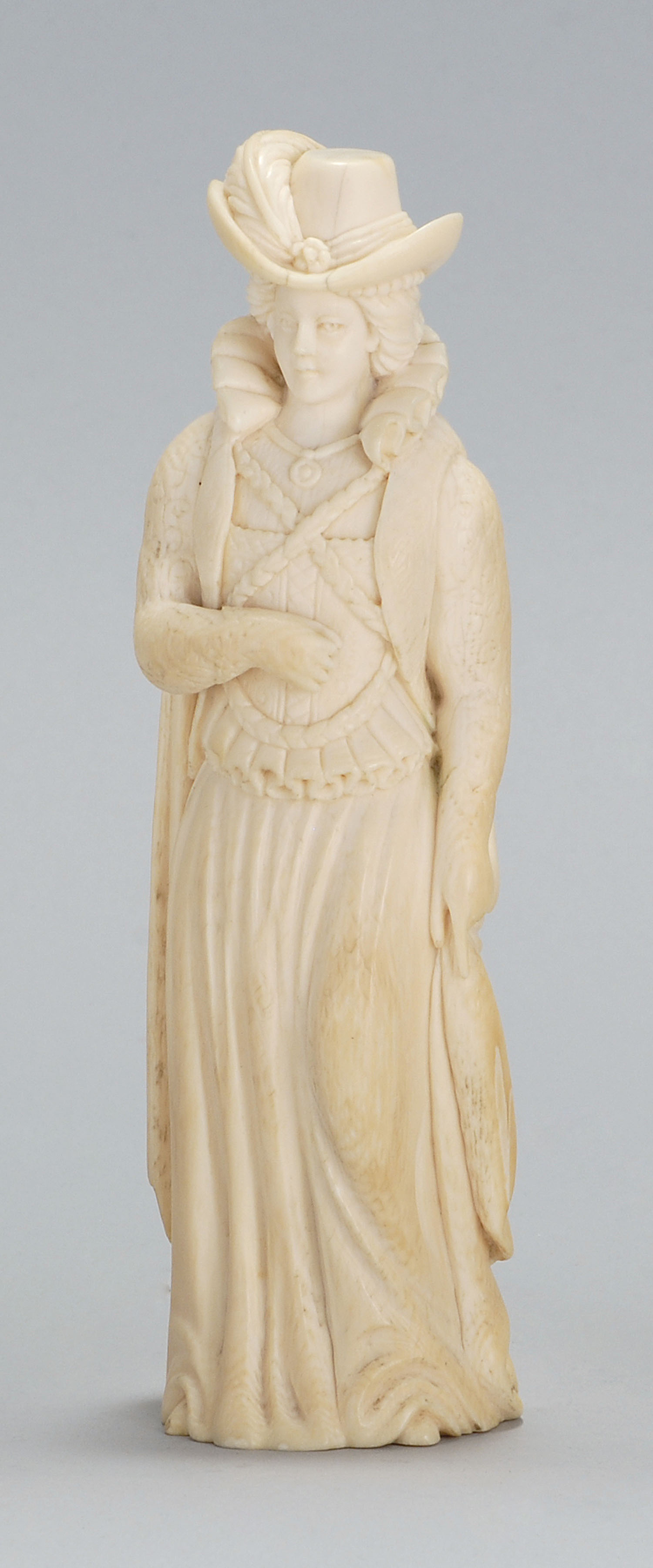 Appraisal: CONTINENTAL IVORY FIGURE Circa Depicting a woman wearing a plumed