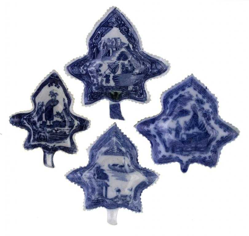 Appraisal: FOUR BLUE PRINTED EARTHENWARE PICKLE DISHES of vine leaf shape