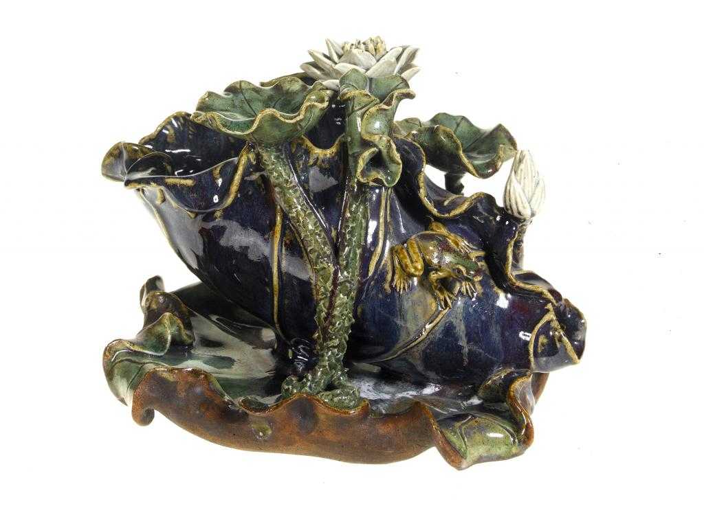 Appraisal: A CHINESE STONEWARE WATERLILY CENTREPIECE modelled with a frog in